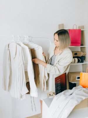 A Woman Choosing Clothes from the Rack