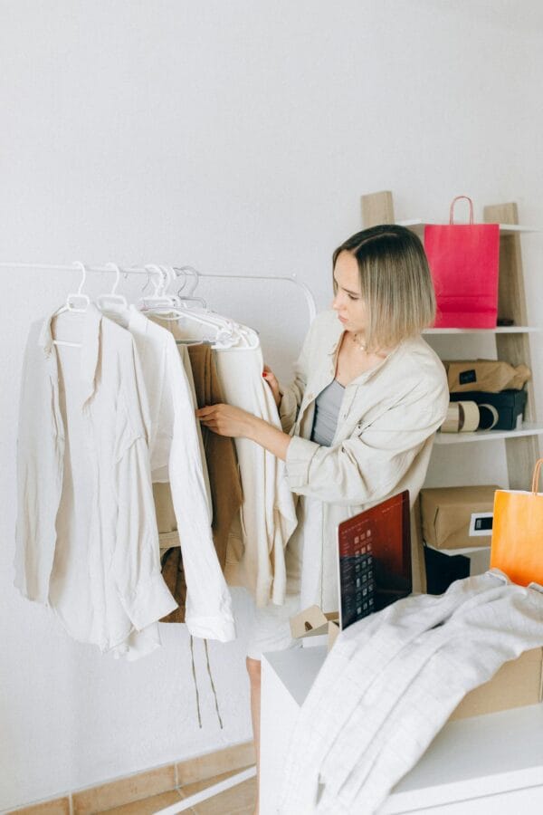 A Woman Choosing Clothes from the Rack